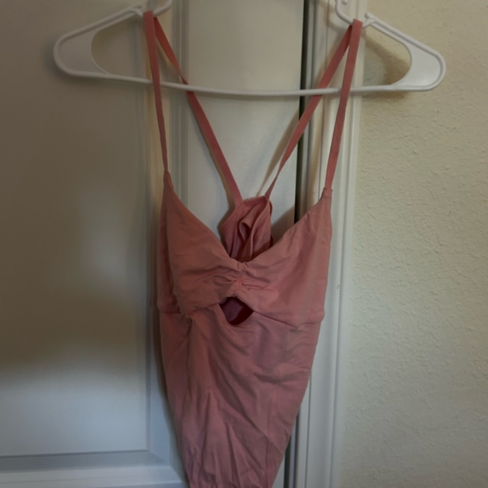 Pink body suit
